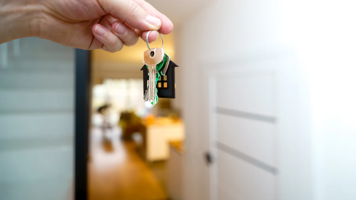 A hand holding a key near an apartment doorway.