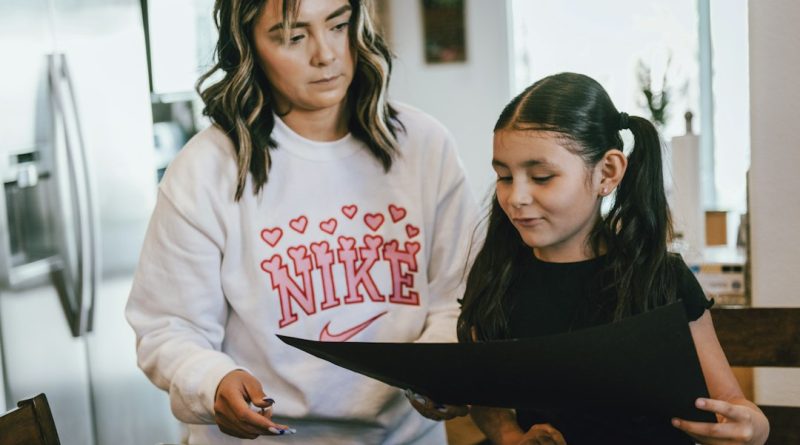 A mother and daughter together, representing a difficult family conversation about an apartment lease.