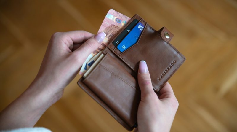 A brown leather wallet, representing a lost wallet containing an unexpected family connection.