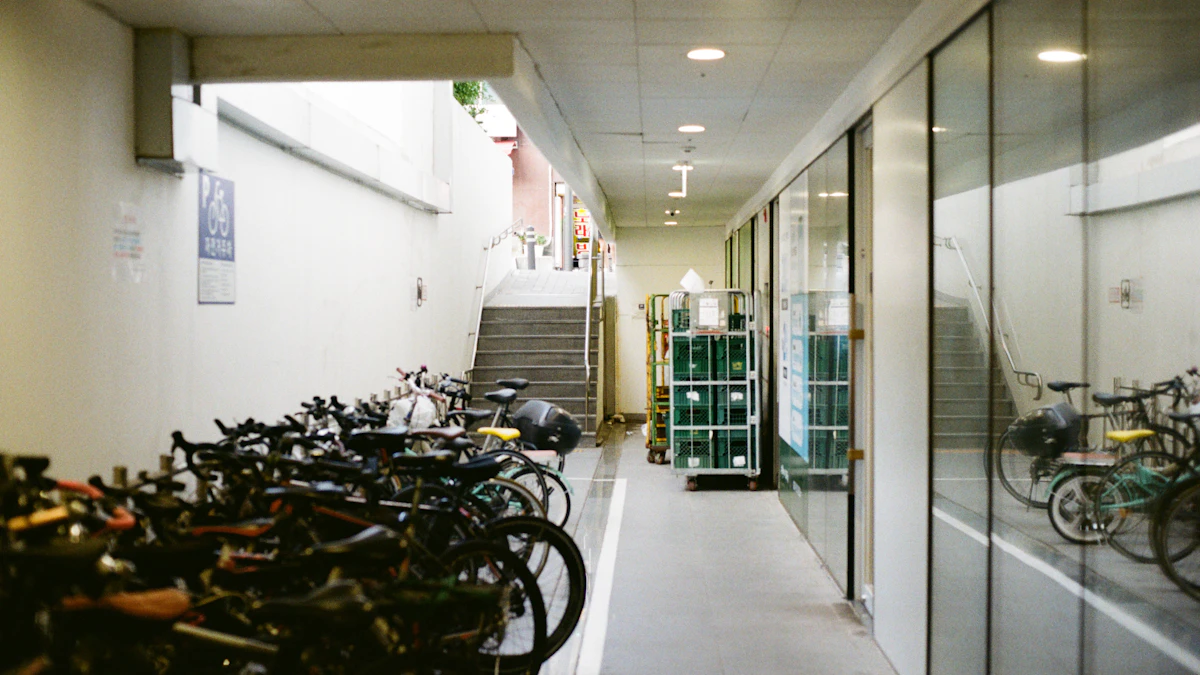 A residential building storage corridor with bicycles and doors.