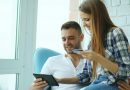 A couple reviewing information together, representing a conversation about shared finances.