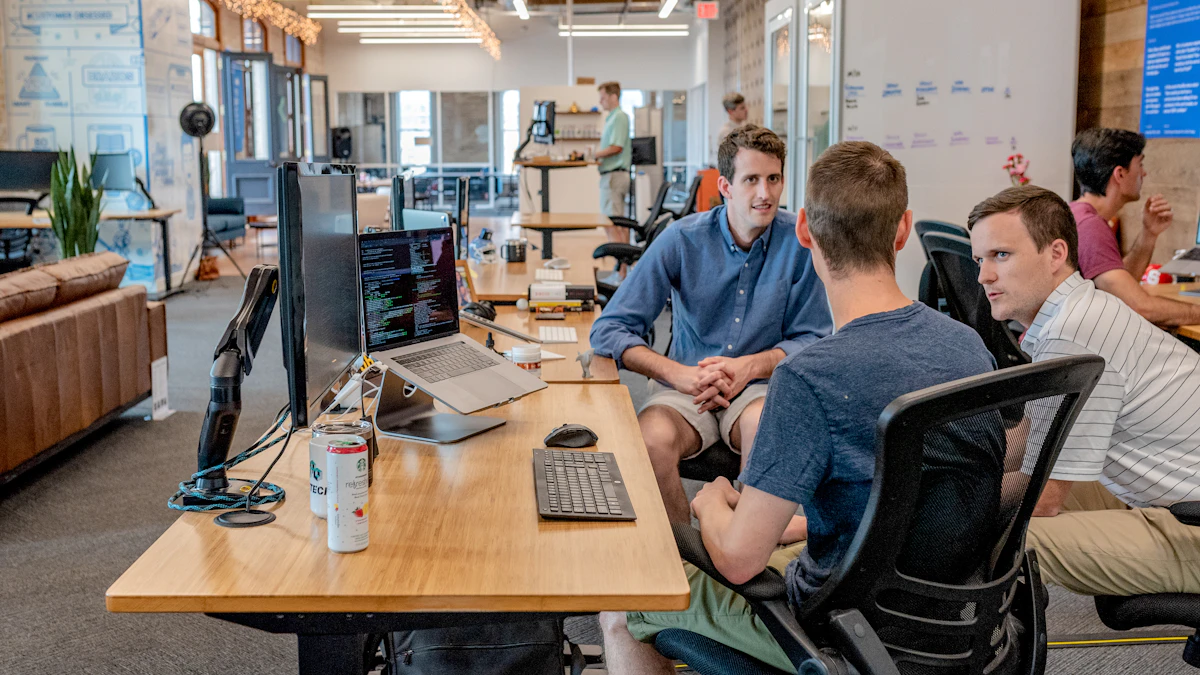 Coworkers discussing a project together in an office.