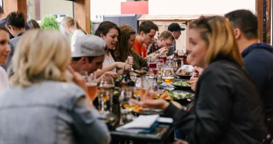 A group of friends sharing dinner around a table.