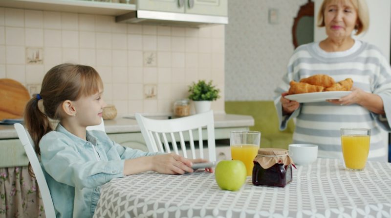 An elderly grandmother at home, representing a family discussion about memory, independence, and care.