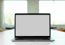A laptop displaying an online job listing in an office.