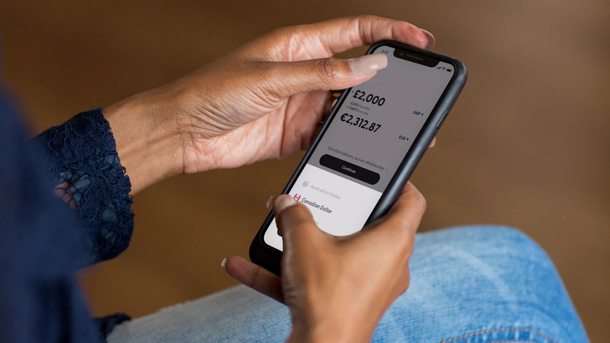 Hands using a smartphone banking app to transfer money.