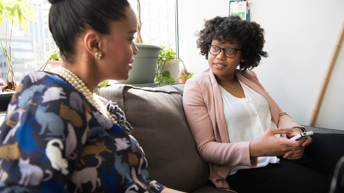 Two adult women having a serious conversation together.