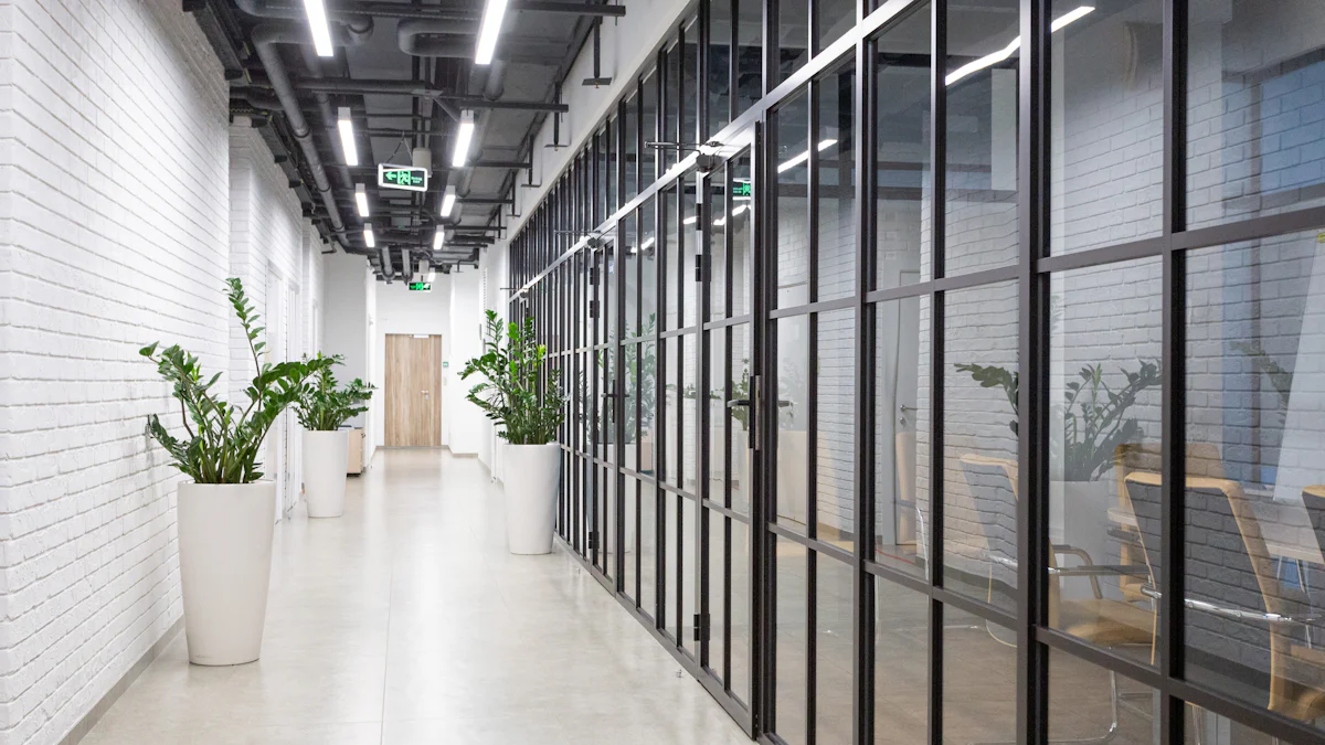 A quiet modern office hallway in the evening.