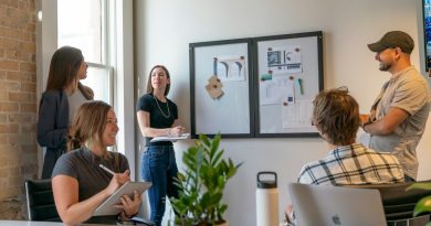 Coworkers collaborating in a modern office meeting.