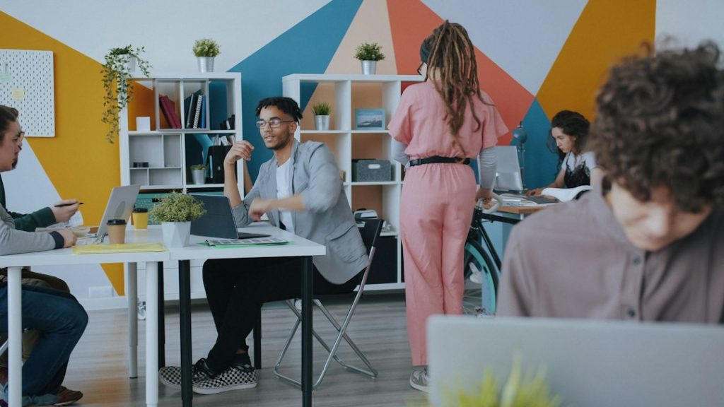 A modern office workspace, representing a desk reassignment and workplace communication problem.