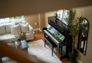 An upright piano in a living room.