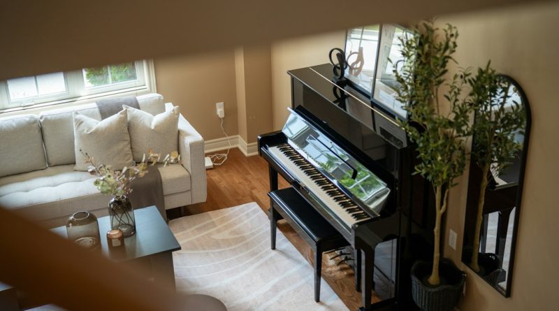 An upright piano in a living room.