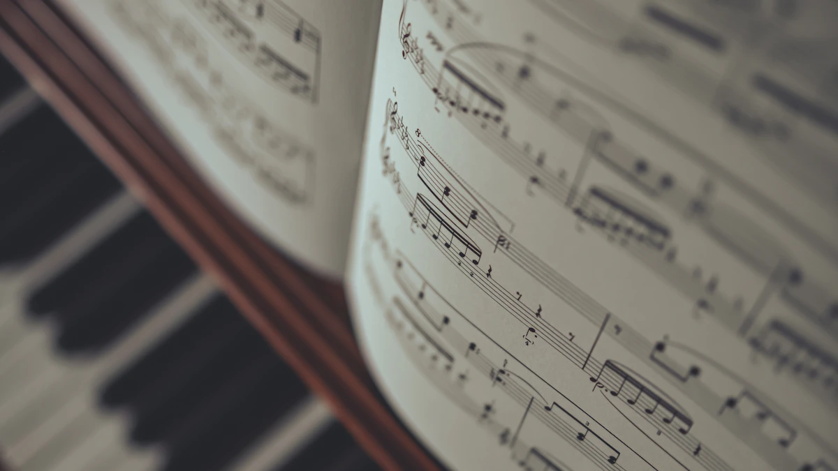 An open book of printed sheet music.