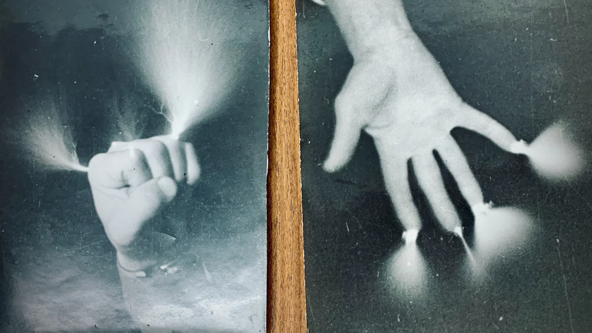 Printed photographs arranged and held by hand.