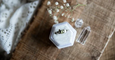 A vintage ring resting in a small jewelry container.