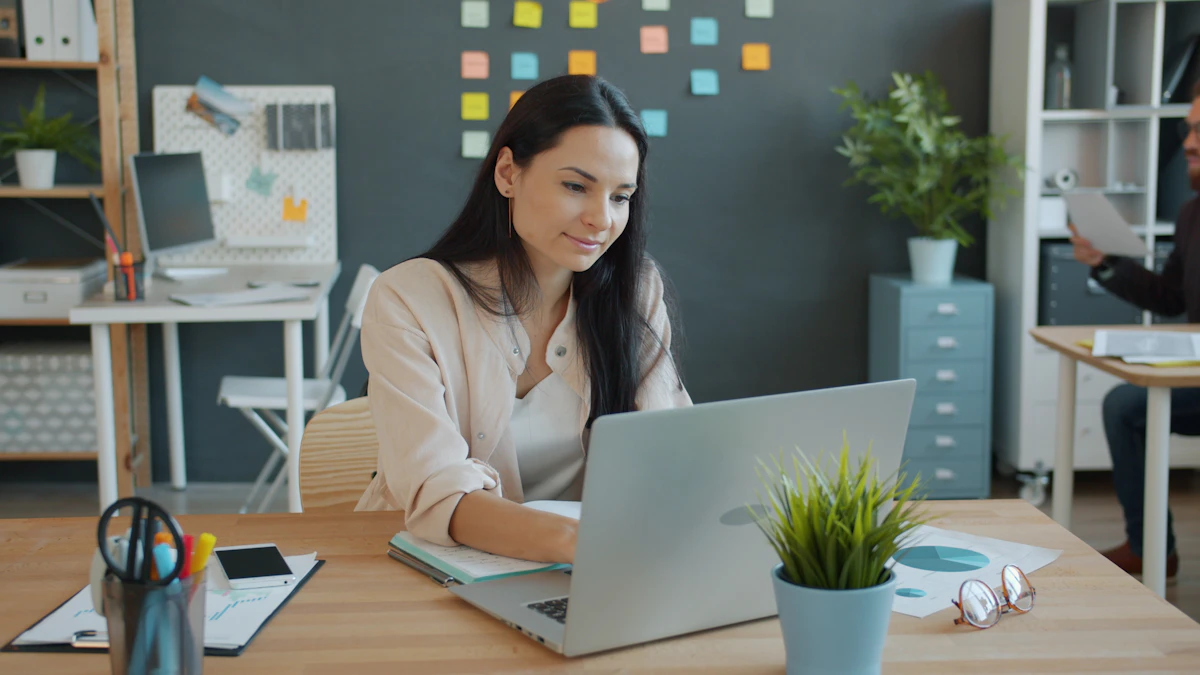 Two coworkers discussing a project together in a creative office.
