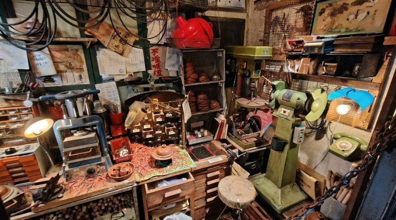 An old workshop with tools, representing a hidden phone discovered among a father's belongings.